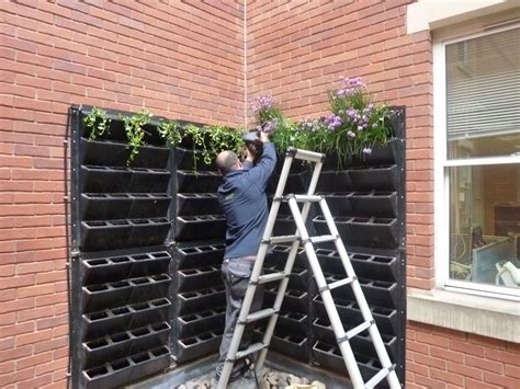 turn a vertical space into an edible living wall urban planters wall planters outdoor wall