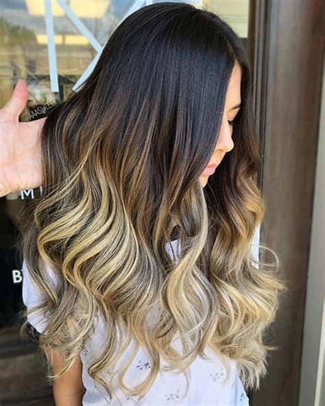 Fantastic wavy hairstyle with blonde and light brown highlights. 21 Chic Examples of Black Hair with Blonde Highlights ...