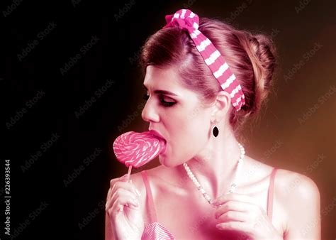 Woman Eating Lollipops Girl In Pin Up Style Hold Striped Candy Fun