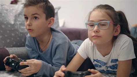 Siblings Enjoy Video Game At Home Girl Close Stock Footage Sbv