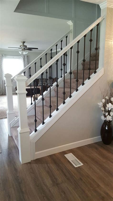 The bars for this modern interior stair railing are hollow and connected to stainless steel posts with plastic inserts. Ballusters | Stair railing makeover, Modern staircase, Modern stair railing