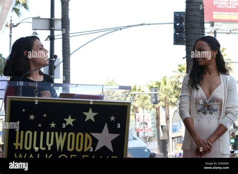 Mila Kunis Zoe Saldana At The Zoe Saldana Star Ceremony On The Hollywood Walk Of Fame On May 3