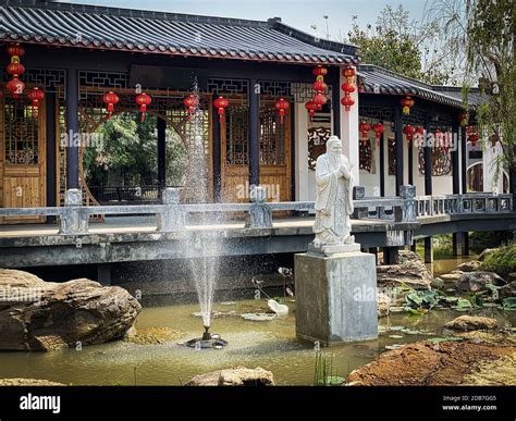 Chinese Garden Asian Architecture With Confucius Statue And Fountain