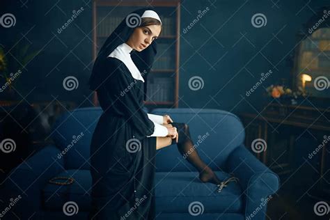 Nun In A Cassock Puts On Stockings With Lace Stock Image Image Of Corrupt Makeup 172002603