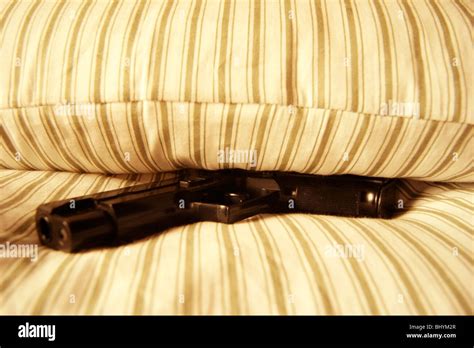 Gun In A Bed Stock Photo Alamy