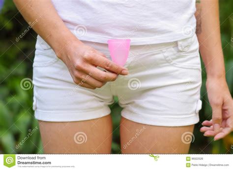 Close Up View Of Young Woman Holding A Menstrual Cup In