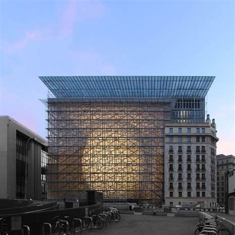 eu headquarters features glass box containing curvaceous glowing lantern architecture