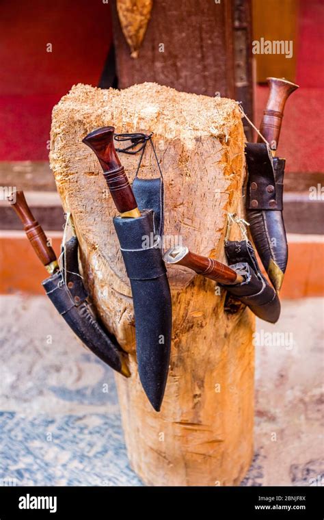 Traditional Nepali Knife Khukuri Hanging On Wooden Stand For Sale In