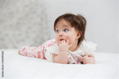Happy Six Months Old Baby Girl Lying On Blanket Stock Photo Adobe Stock