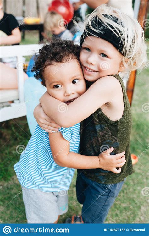 Two Happy Little Boys Hug Each Other Stock Photo Image