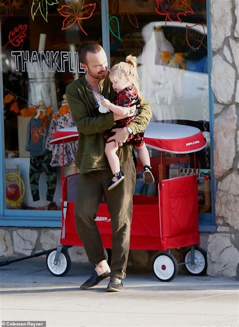 Aaron Paul Helps One Year Old Daughter Story Pull A Red Radio Flyer