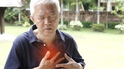 Asian Senior Man Chest Pain Heart Attack Stroke Health Care Stock Photo