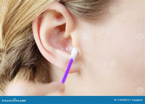 Woman Cleaning Ear With Cotton Swabs Closeup Stock Photo Image Of