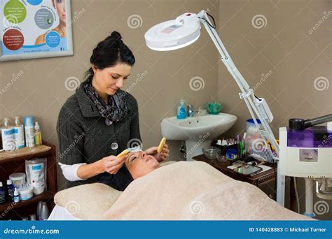 Beauty Therapist Doing A Facial Procedure In A Day Spa Editorial Stock