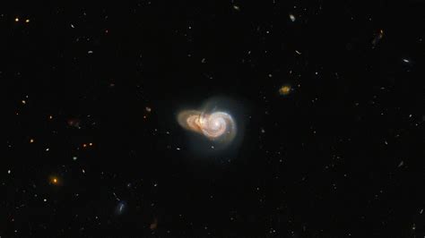Hubble Space Telescope Snaps A Photo Of Two Overlapping Galaxies A