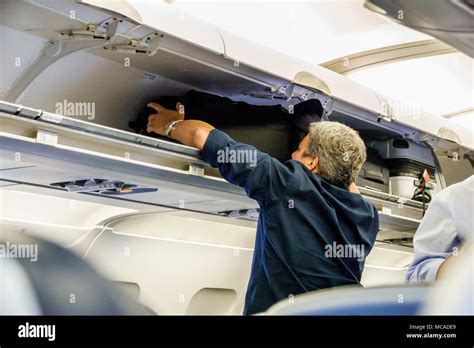 Overhead Compartment Luggage Hi Res Stock Photography And Images Alamy