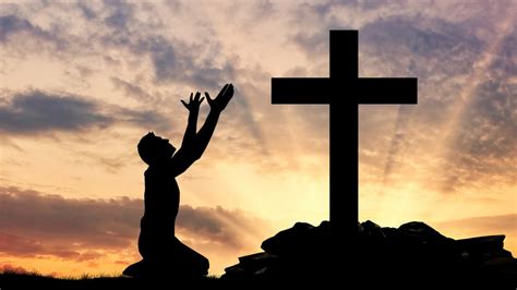 1 17 Nt Silhouette Man Kneeling Praising God At Foot Of Cross