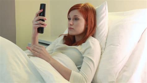 beautiful redhead pregnant woman talking on the phone
