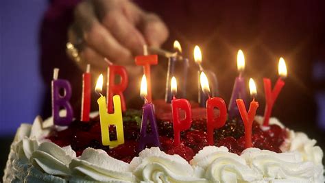 Three candles on a chocolate cake. Burning Candles On A Birthday Cake Stock Footage Video ...