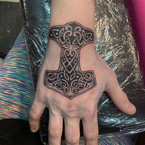 Amazing Mjolnir Tattoo Designs You Need To See Mjolnir Tattoo Thor Hammer Tattoo Viking