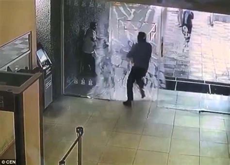 Shocking Moment Worker Runs Smack Bang Into A Glass Door In Mexico Daily Mail Online