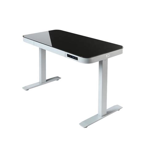 A Black And White Computer Desk Sitting On Top Of A Metal Stand Up Leg Rest