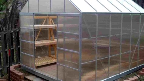 This charming little greenhouse is made from 4 window panels and 2 plywood panels. Image result for diy greenhouse shelves (With images ...