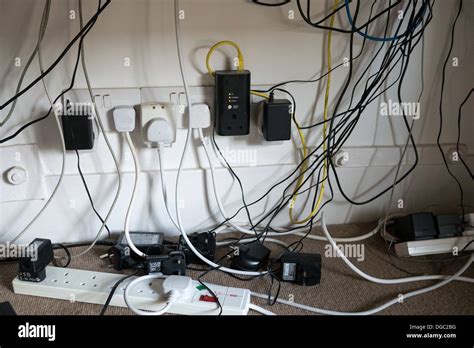 A Jumble Of Power Cables And Computer Wires Under A Desk Photo Stock