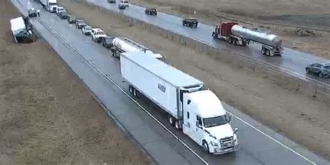 strong winds blow semi trucks over on minnesota highway