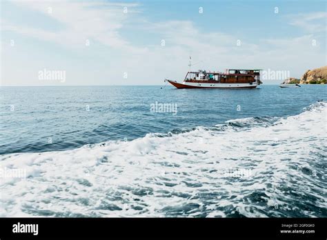 A Boat Floating On The Surface Of The Water Stock Photo Alamy