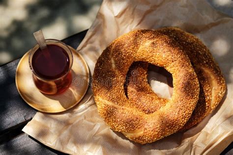 Traditional Turkish Sesame Bagel Simit And Turkish Tea On Wood