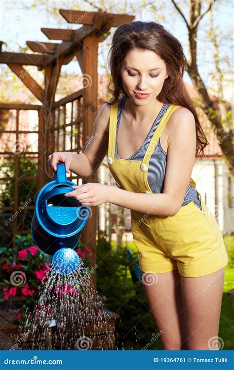 Woman Watering Flowers Stock Image Image Of Fence Outside 19364761