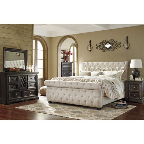 With a plush upholstered headboard and rich dark mink finish, this upholstered sleigh bed perfectly balances transitional sophistication and warmth. Darby Home Co Althea Upholstered Sleigh Customizable ...