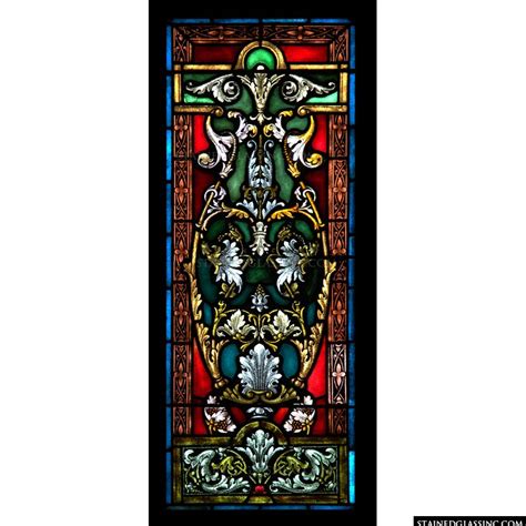 ornate red and green stained glass window
