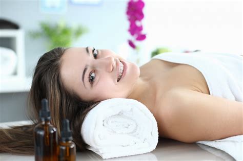 Premium Photo The Woman Lies In A Massage Room And Smiles