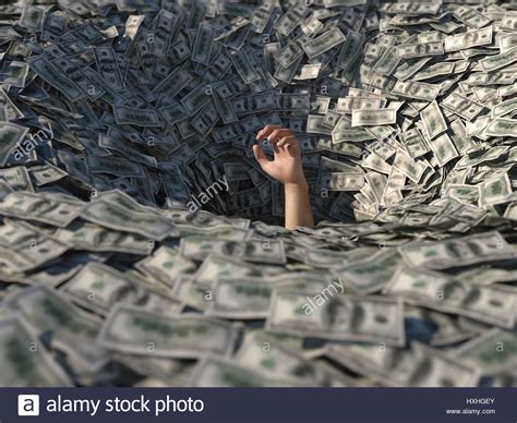 Hand Drowning In Money Stock Photo Royalty Free Image 136839779 Alamy