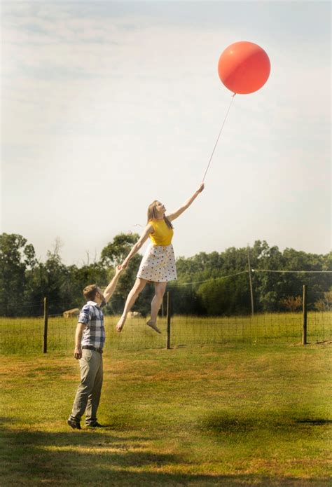Cute Engagement Photo Features Bride To Be Floating Away On A Balloon