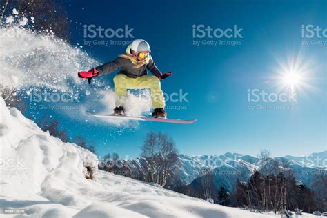 Girl Is Jumping With Snowboard Stock Photo Download Image Now