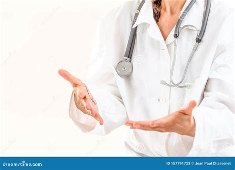 Female Doctor Explaining Patient Symptoms Or Asking A Question As They