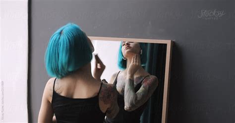 Babe Woman With Green Hair Applying Makeup By Stocksy Contributor Alexey Kuzma Stocksy