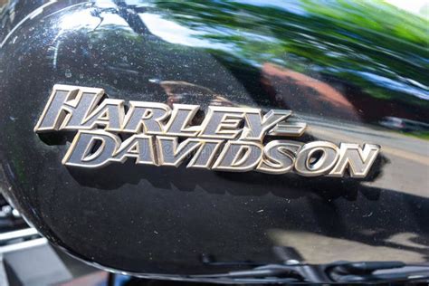 Harley Davidson Logo On A Black Motorcycle Harley Davidson Is An