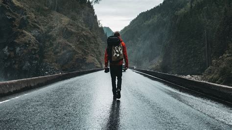 Man Is Walking Alone On Road Between Mountains 4k Hd Alone Wallpapers