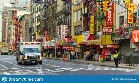 Ambulance Passing Through Chinatown In Manhattan New York Usa