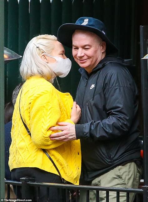 Mike Myers Gives His Wife Kelly Tisdale A Kiss While Hanging Out With