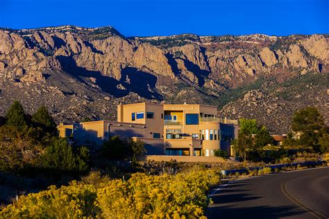 Houses On Simms Park Road With The Sandia Mountains Cibola National