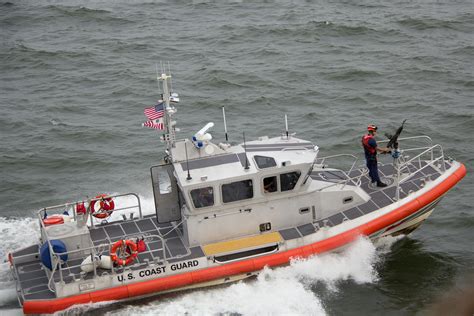 White Orange Us Coast Guard Boat On The Sea · Free Stock Photo