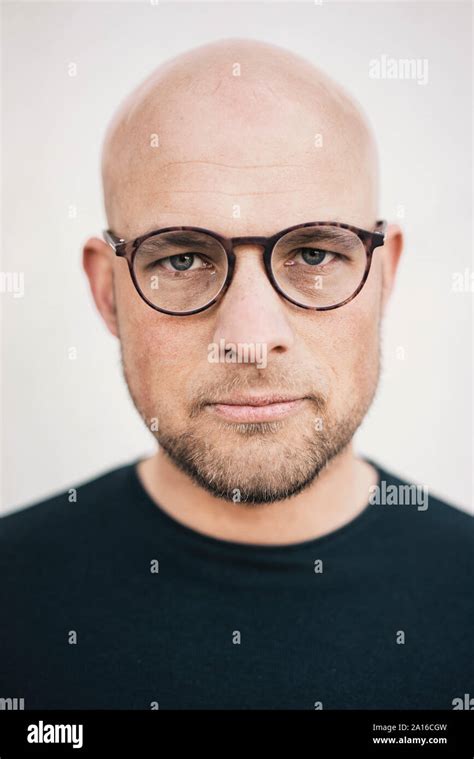 Portrait Of Serious Bald Man With Beard Wearing Glasses Stock Photo Alamy