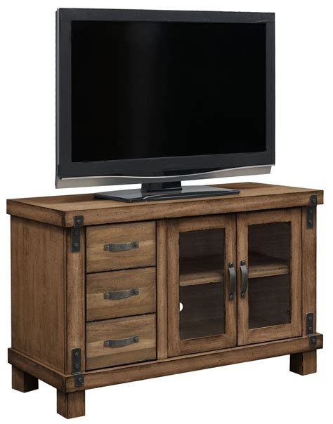 An Entertainment Center With Drawers And A Flat Screen Tv On Top Of It