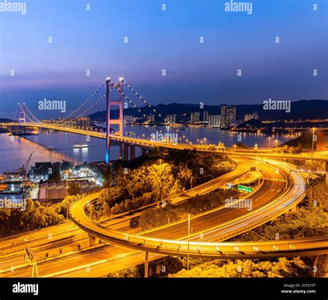Sunset And Light Illumination Of Tsing Ma Bridge Landmark Suspension