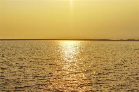 Landscapesunset Reflect Light With Sea Water In Yellow Gold Stock